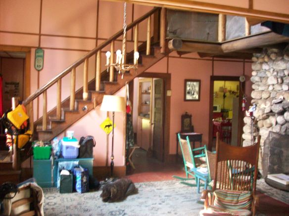 foyer, fireplace, staircase, kitchen and dining room in background